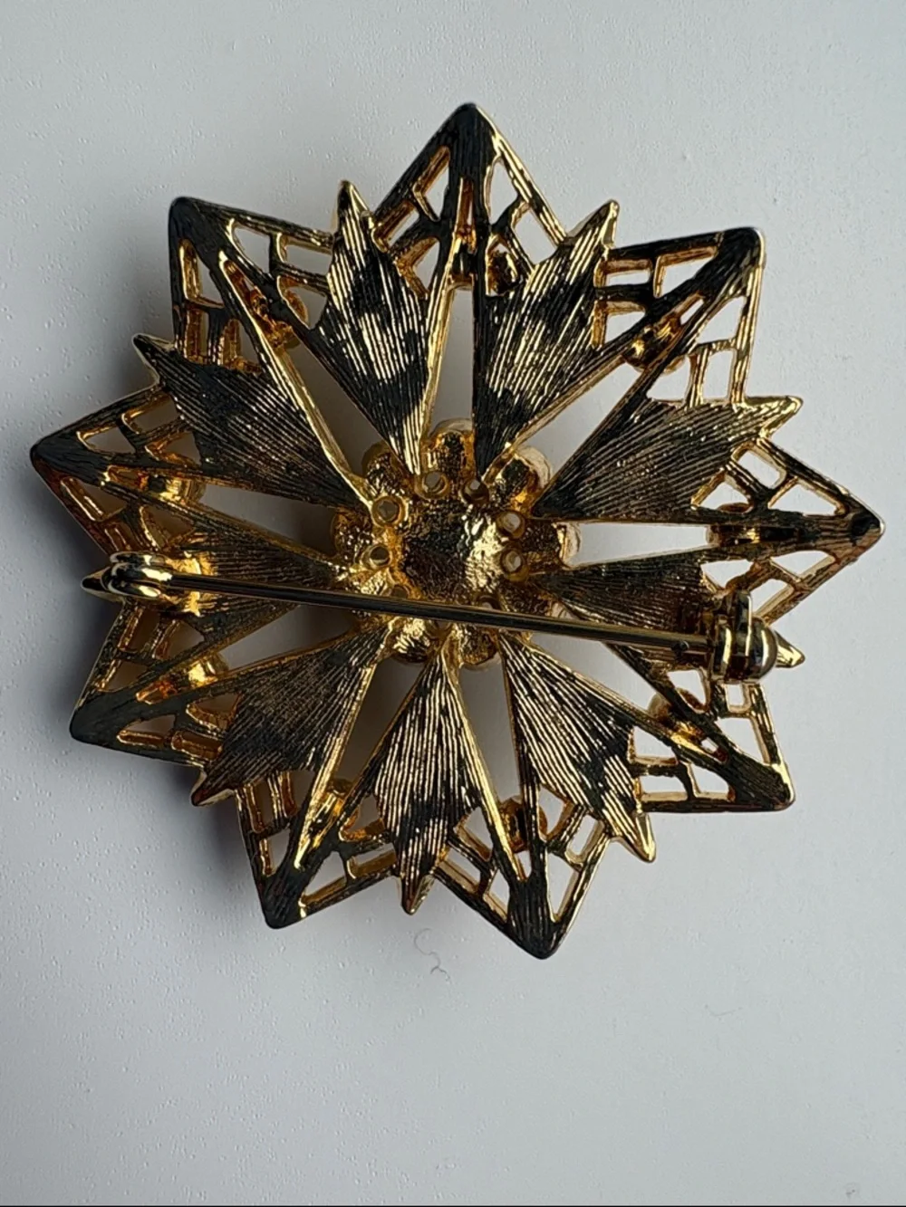 Vintage Gold Tone Black Enamel Starburst Brooch with Clear Rhinestones